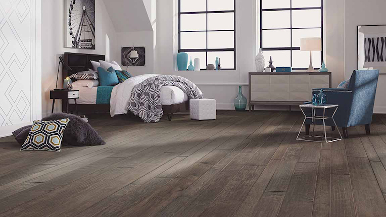dark stained hardwood flooring in a stylish bedroom