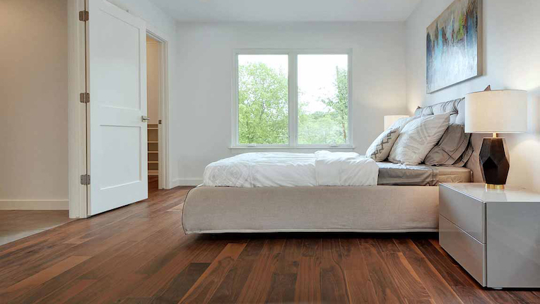 charming hardwood flooring in a minimalist bedroom
